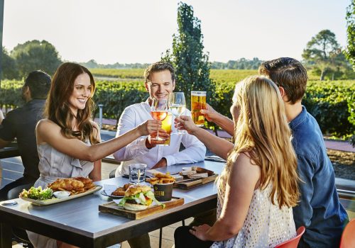 Friends enjoying a meal at Mandoon Estate & Homestead Brewery, Swan Valley